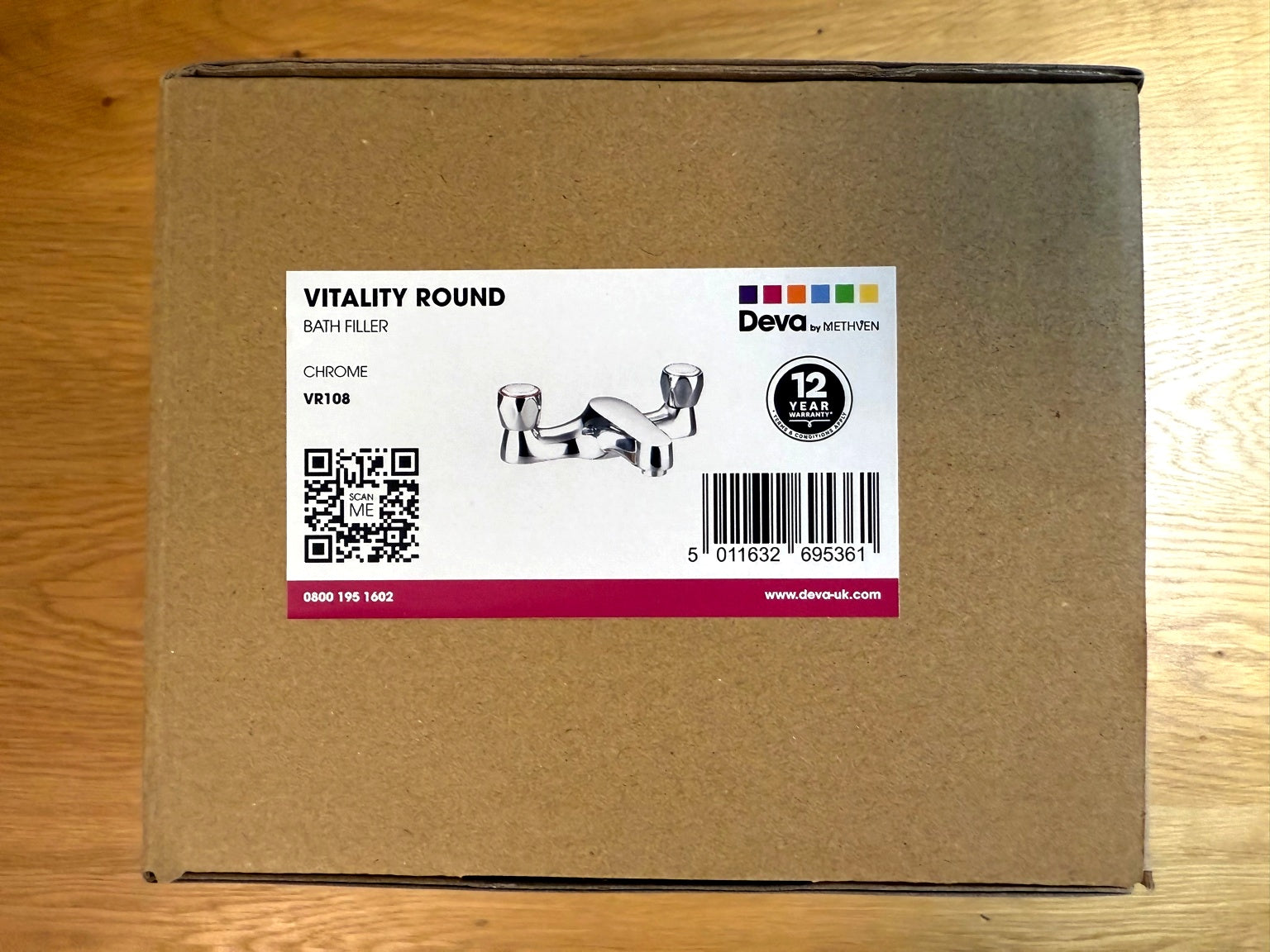 Deva Vitality chrome bath filler tap – packaged view in the box by IrishBath.ie