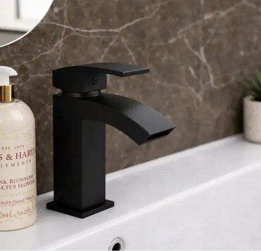Matt Black Waterfall Mono Basin Mixer Tap - Kinlin installed on a white basin in the bathroom of IrishBath