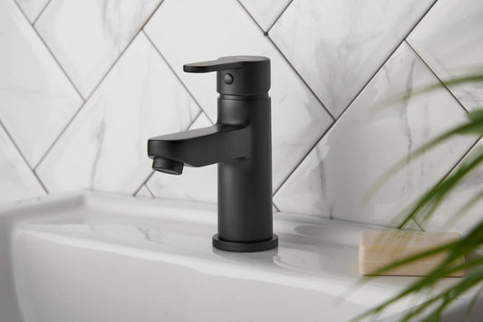 Deva Ethos matt black basin tap installed on bathroom sink with matching waste at IrishBath