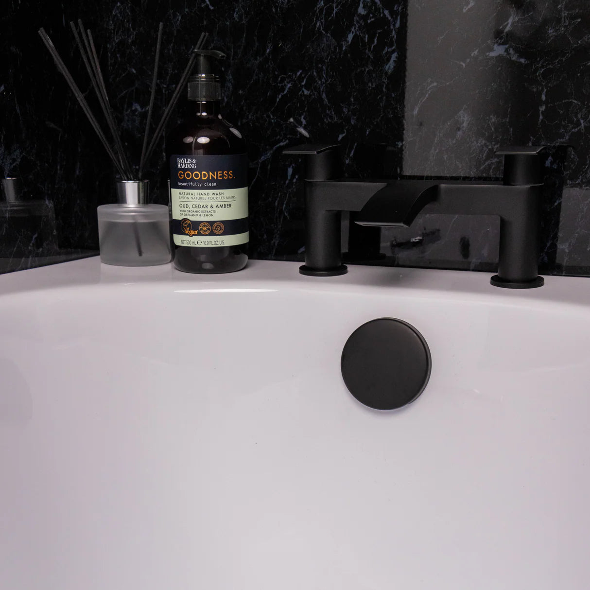 matt black bath waste with overflow installed in modern bathtub at Irishbath.ie shop