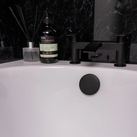 matt black bath waste with overflow installed in modern bathtub at Irishbath.ie shop