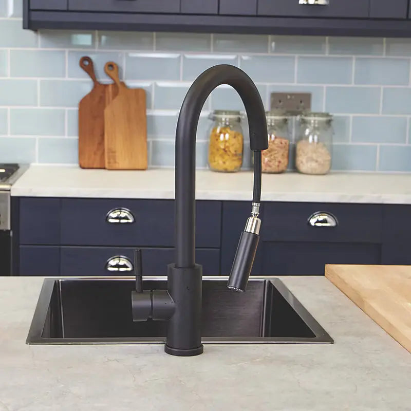 Ellsi Cato Matt black pull-out kitchen tap with spray hose extended during use
