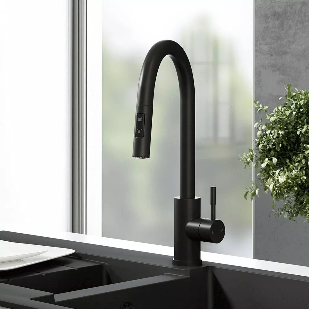 Ellsi black mat kitchen faucet with pull-out and spray installed on a black sink view
