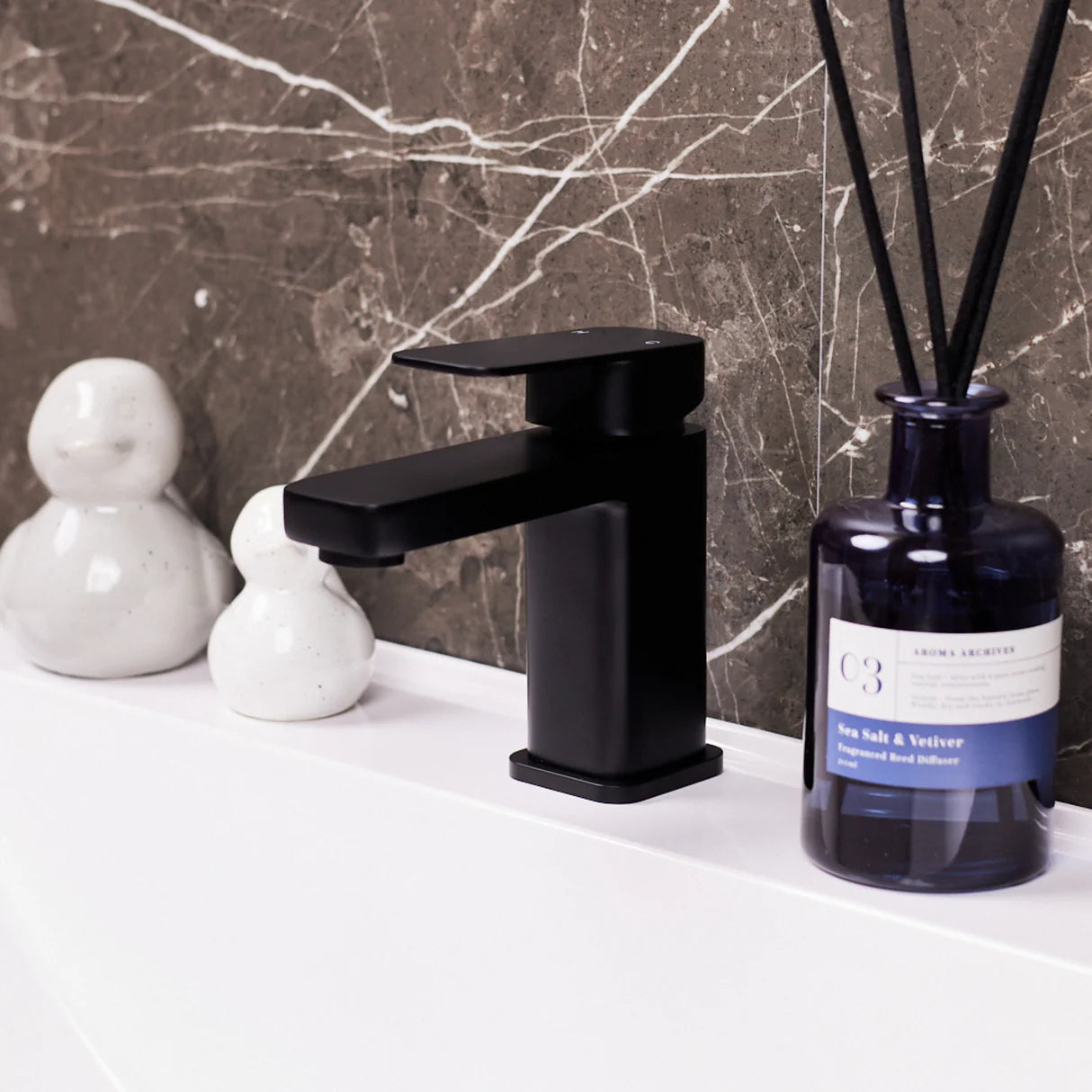 Matt black Ellsi ETAL Lanza mono basin mixer tap on white basin