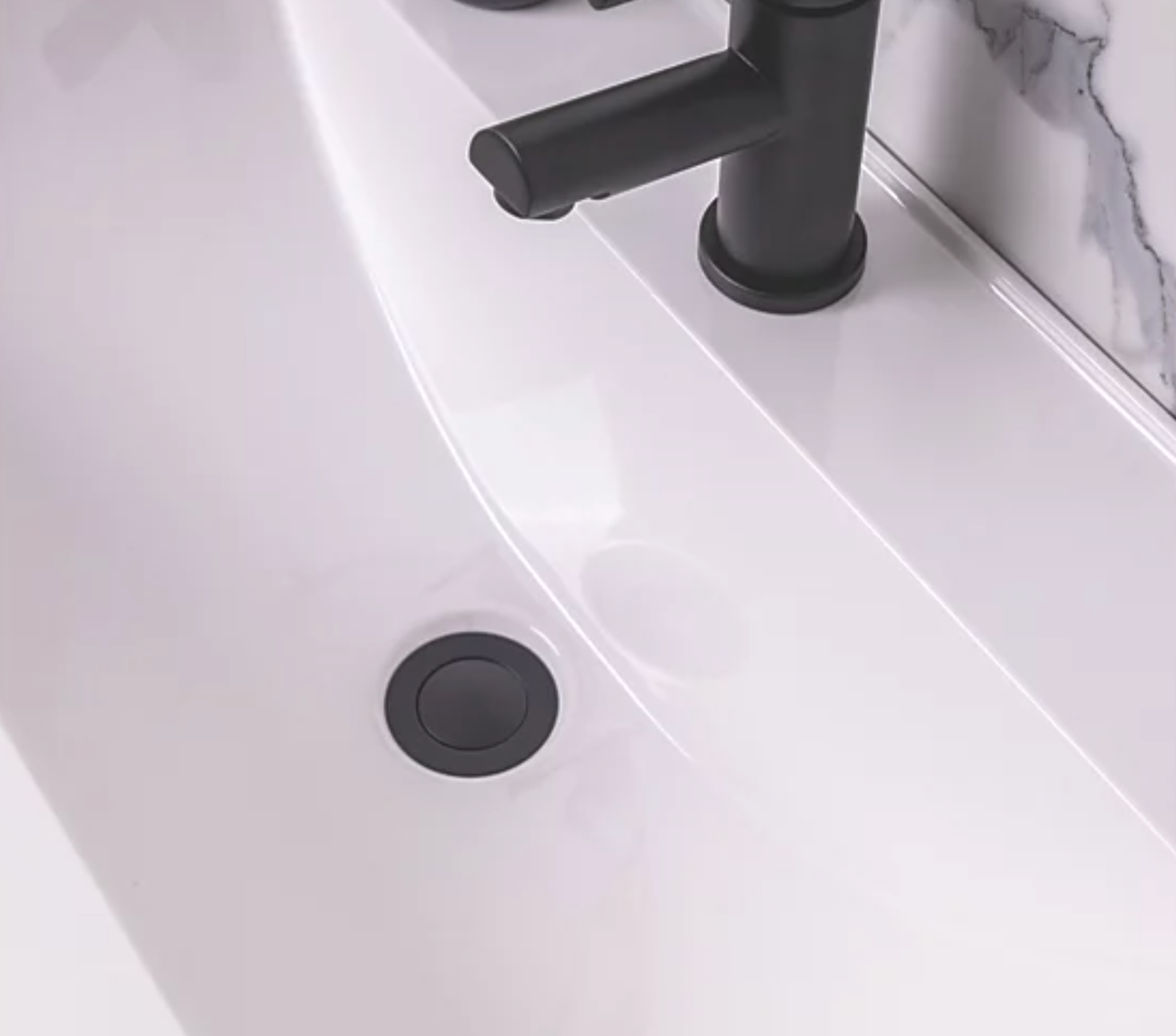 Unslotted G1 1/4 60 mm push button basin waste matt black installed in sink by elsi at Irishbath