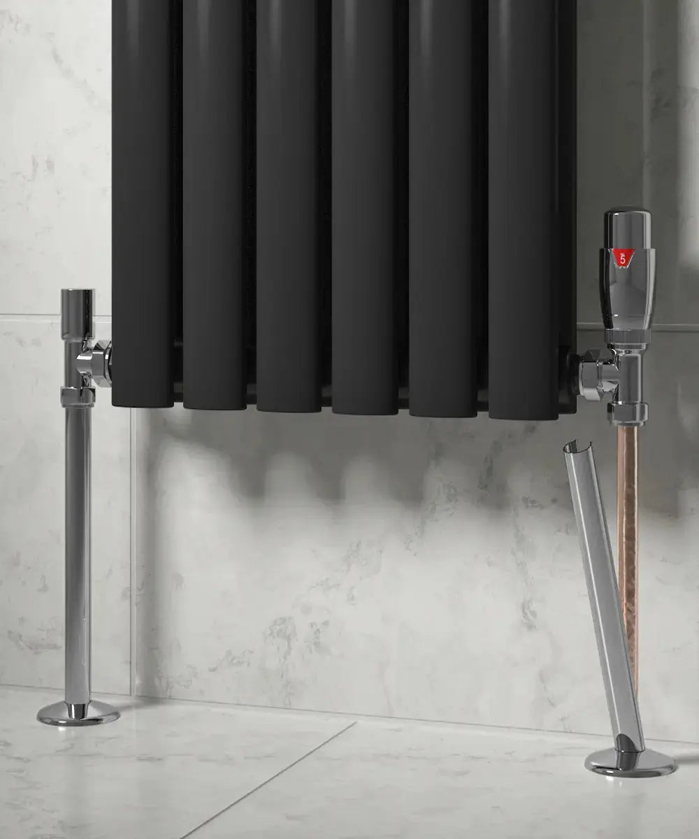 Black radiator with Chrome silver brackets covered by ellsi set on a light gray wall.