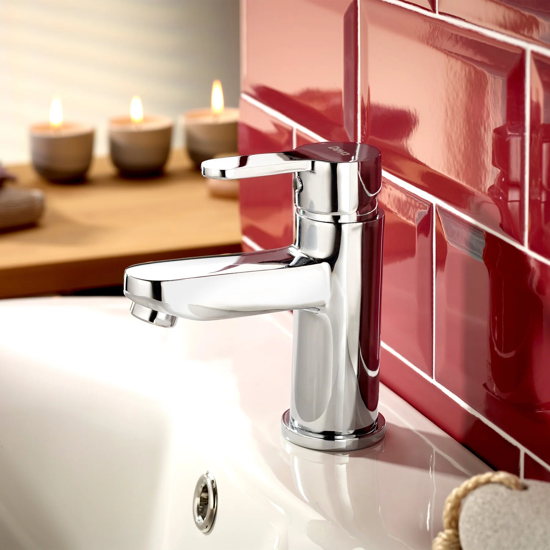 Deva Ethos ETH113 basin mixer faucet installed view on ceramic washbasin with red backgroung at IrishBath.ie