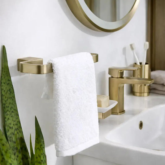 K-Vit Square brushed brass towel ring by Kartell mounted on the wall with white towel at IrishBath