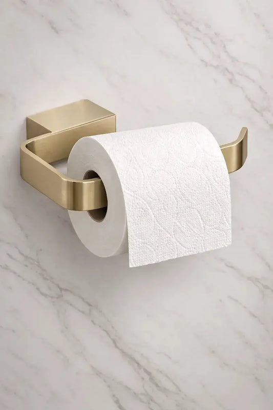 Brushed Brass ACC302 Kartell toilet paper holder on a marble wall at IrishBath