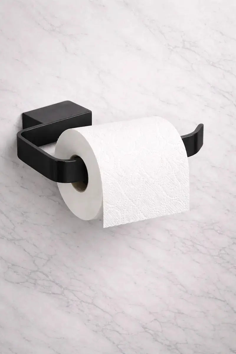 Kartell K-Vit Matt Black toilet paper square roll holder on a marble wall (ACC312) at IrishBath