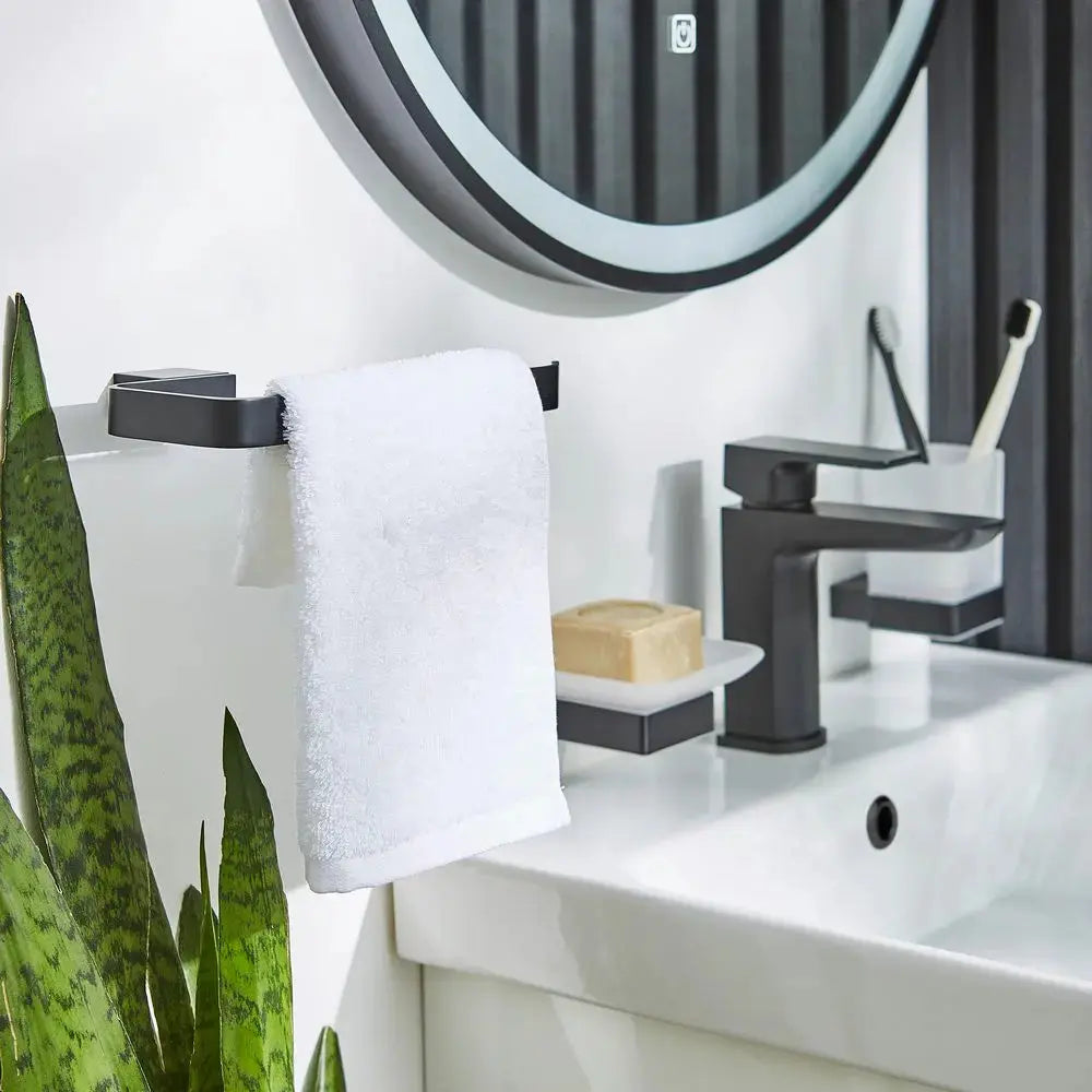 Square matt black brass towel ring by Kartell K-Vit installed on the wall with white towel at IrishBath