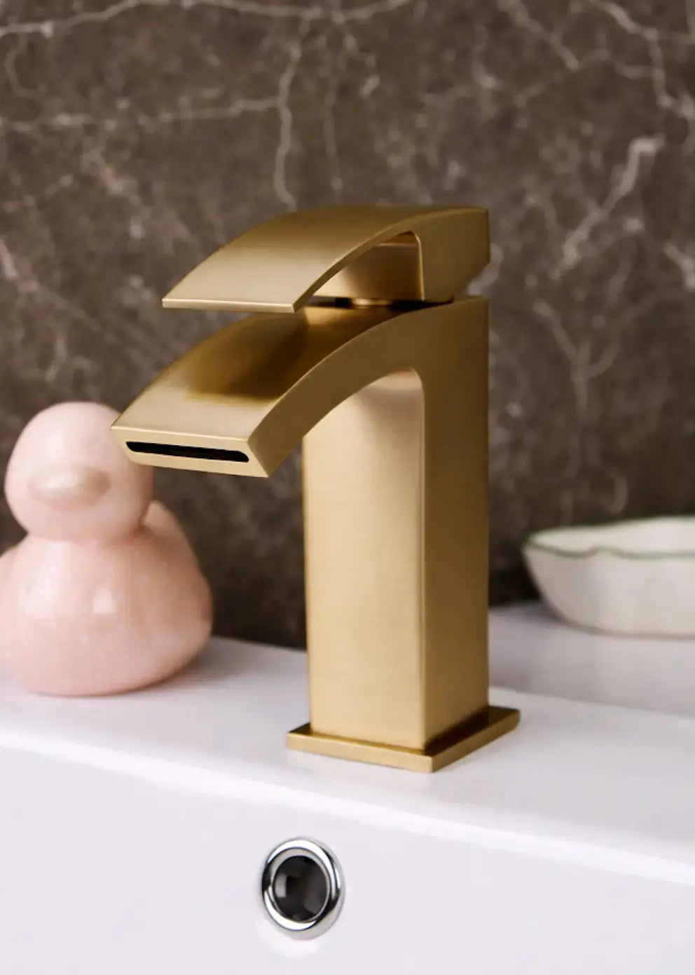 Brushed Brass Waterfall Bathroom Sink Tap installed on a white basin at IrishBath