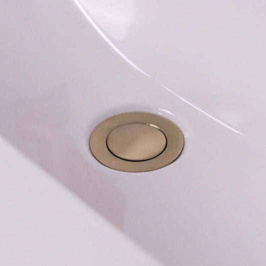 Push-button brushed brass basin waste with overflow slot by Ellsi at IrishBath.ie