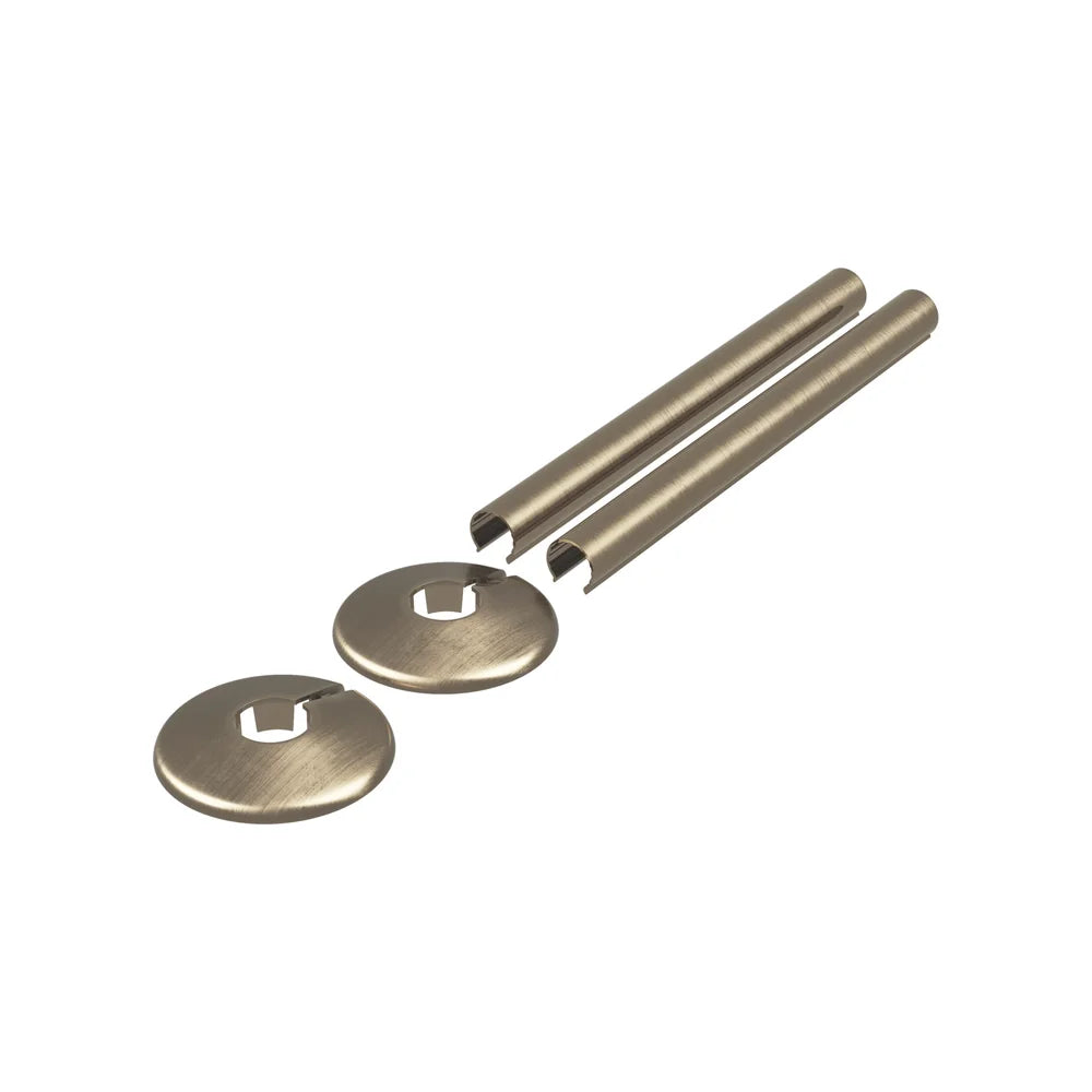 Antique brass radiator pipe covers and two collars for 15mm pipe on a white background