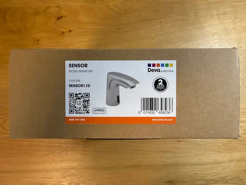 Box with a Deva sensor bathroom faucet label on a wooden surface at IrishBath