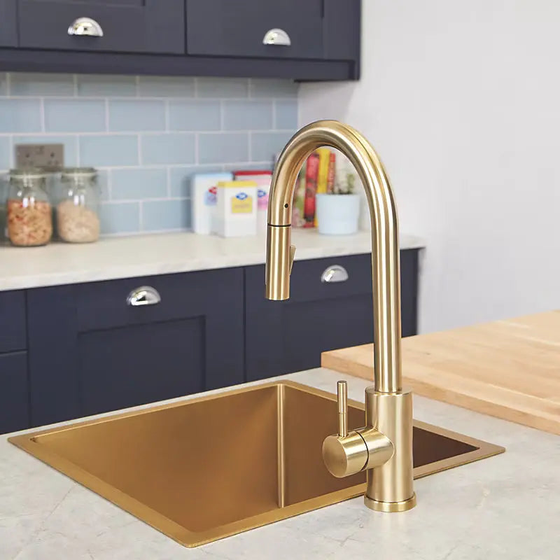 Back Side view of brushed brass pull-out kitchen mixer tap installed on countertop by Ellsi (Etal)