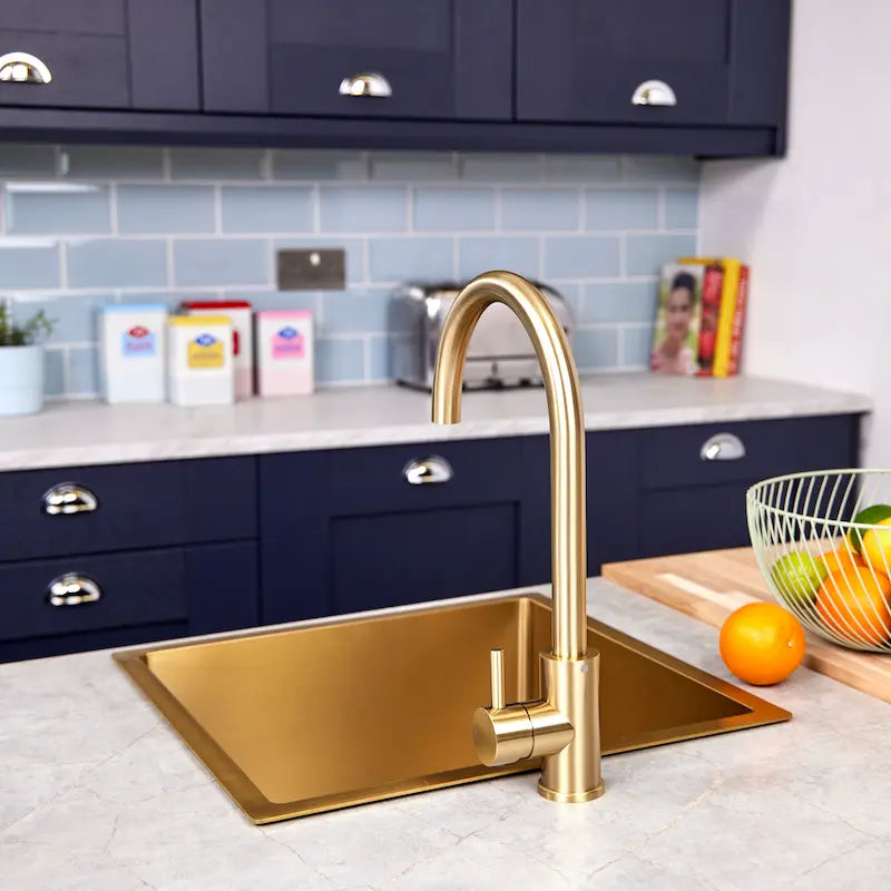 Brushed brass Tivoli kitchen sink tap shown installed on a sink