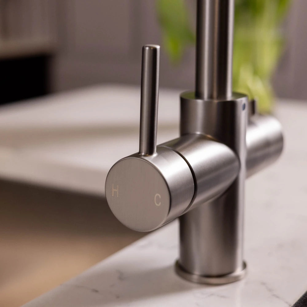 Close-up of the hot and cold lever on the brushed steel 3 in 1 boiling water tap