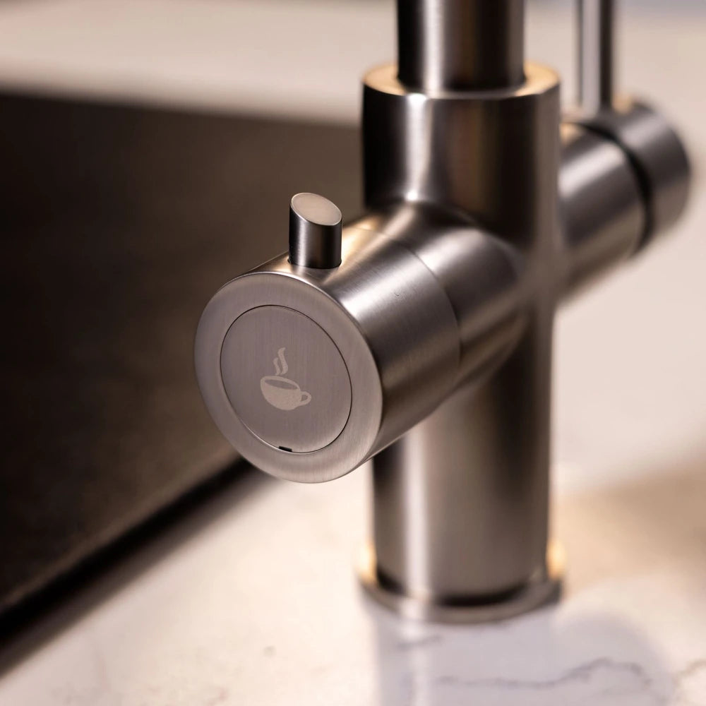 Boiling water lever with cup symbol on the brushed steel 3 in 1 kitchen tap
