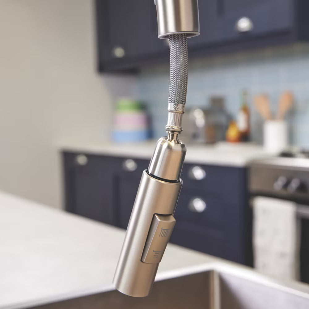 Close view of the Cato brushed steel spray head, showing the button that switches between a stream and a spray.