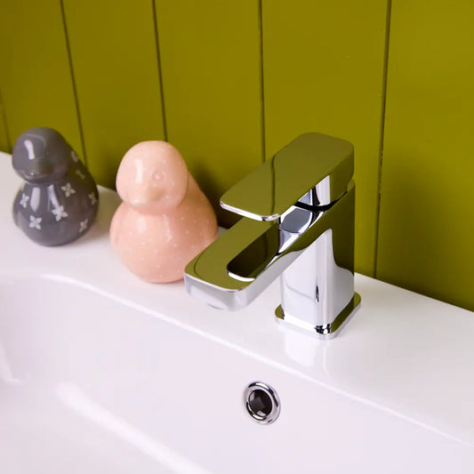 The chrome Lanza basin tap seen from above, showing the flat rectangular lever lying along the top of the square column.