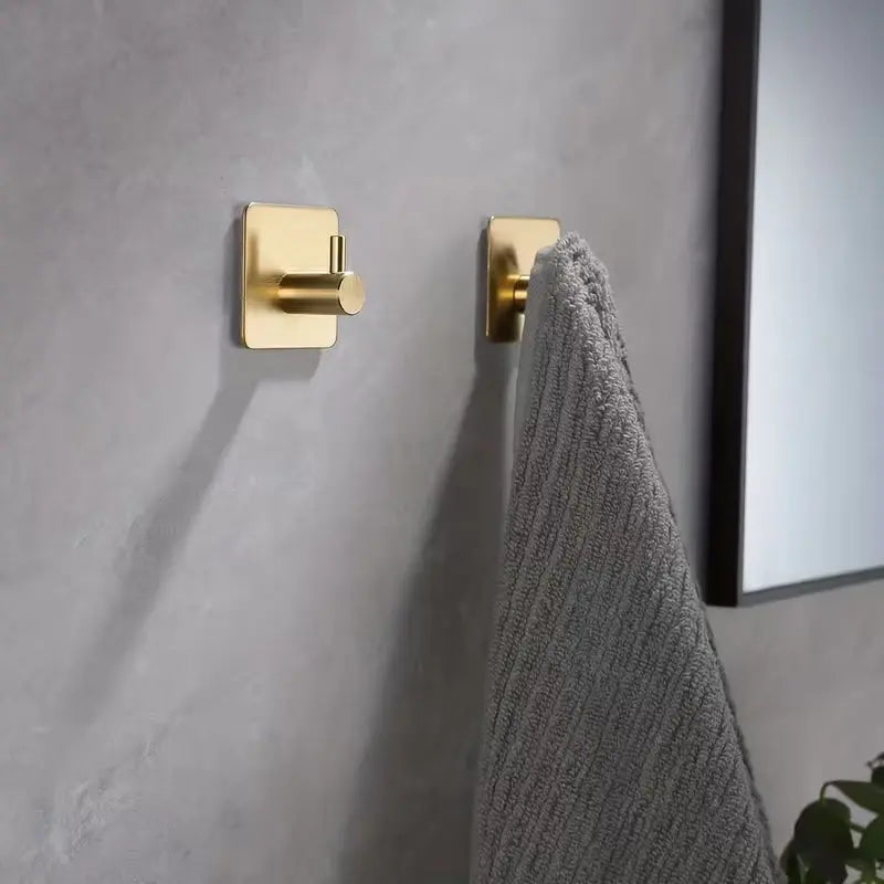 gold brushed brass adhesive hooks arranged for modern home décor by IrishBath.ie
