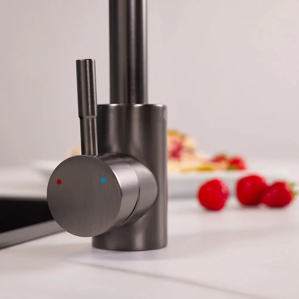 Close-up of the single lever and dark metallic grey body of the Tivoli gunmetal kitchen tap