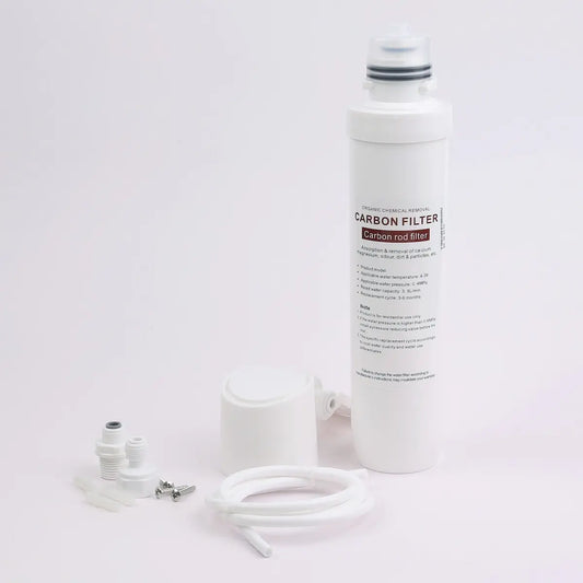 The complete inline water filter kit laid out on a white background: carbon rod cartridge, housing head with wall bracket, quarter-inch push-fit connectors, fixings and a length of tubing